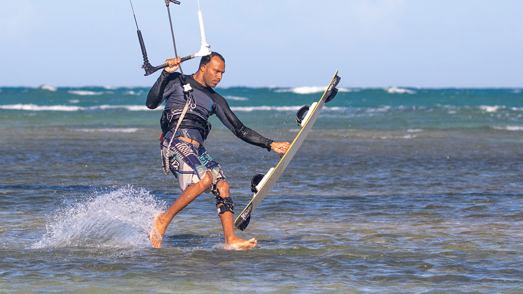 Kiteboarder riding during an advanced lesson on Kite Beach, Cabarete